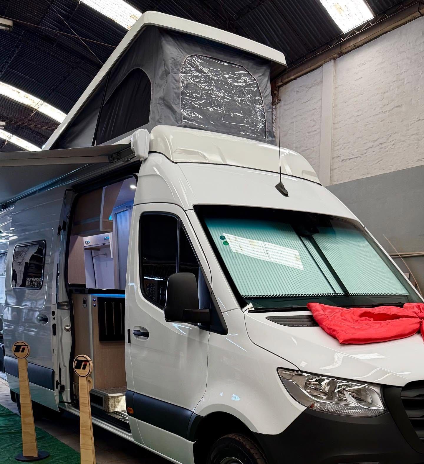 Mercedes-Benz Sprinter converted by Taller Italia with its pop-top roof raised, at the Guaymallén workshop
