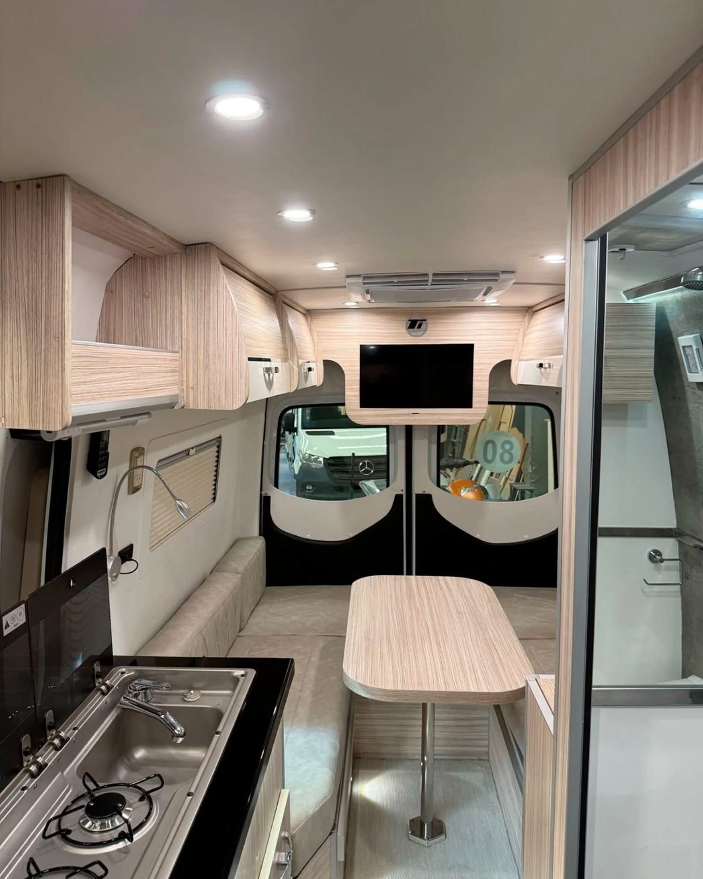 Interior of the Sprinter 414: galley, dinette and the entrance to the shower room