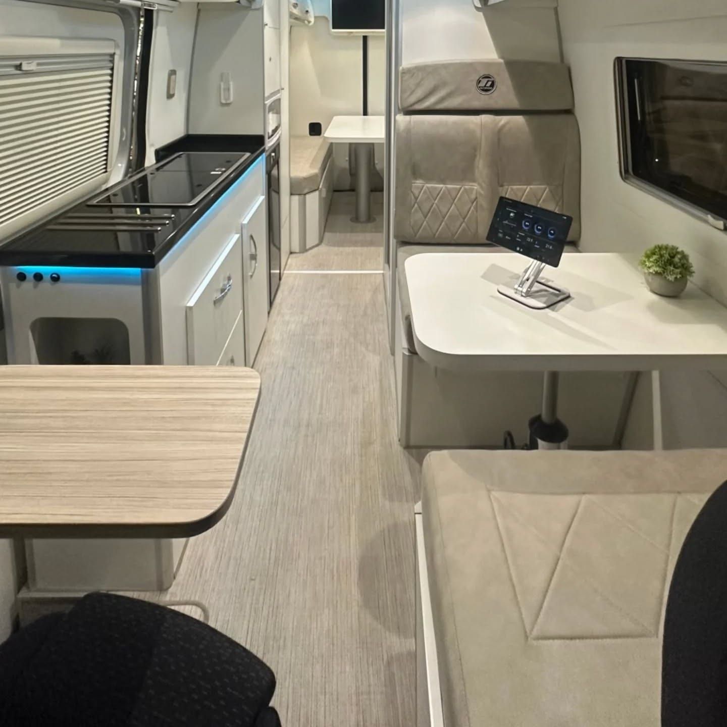 Full corridor view of the Sprinter: galley to the left, dinette to the right and washroom at the rear