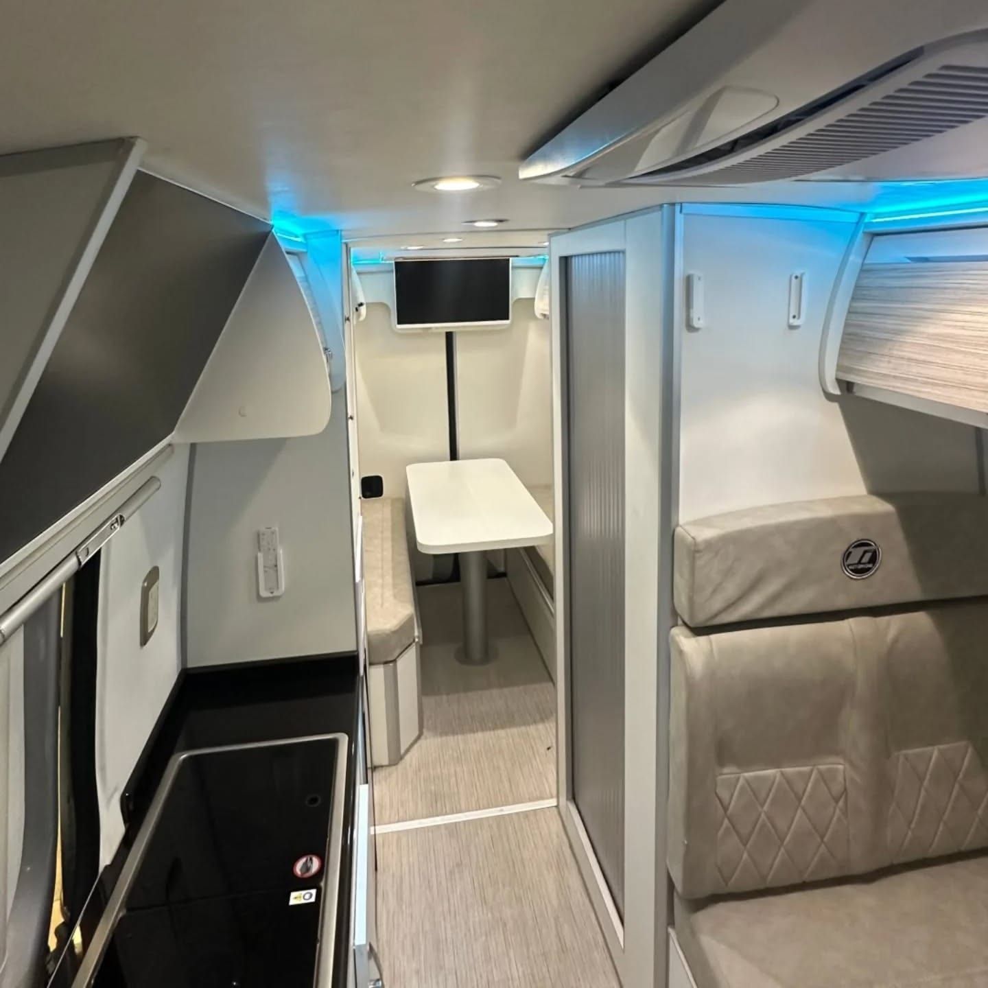 Galley and dinette of the Sprinter, with the shower screen on the right