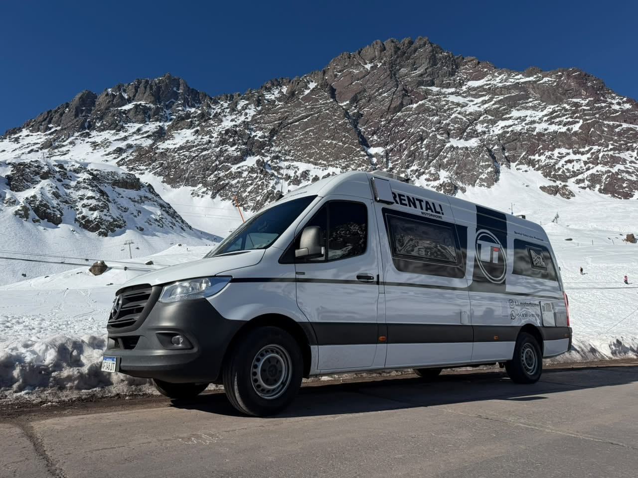 Ti Motorhome rental campervan parked below a snow-covered peak in the Mendoza high Andes